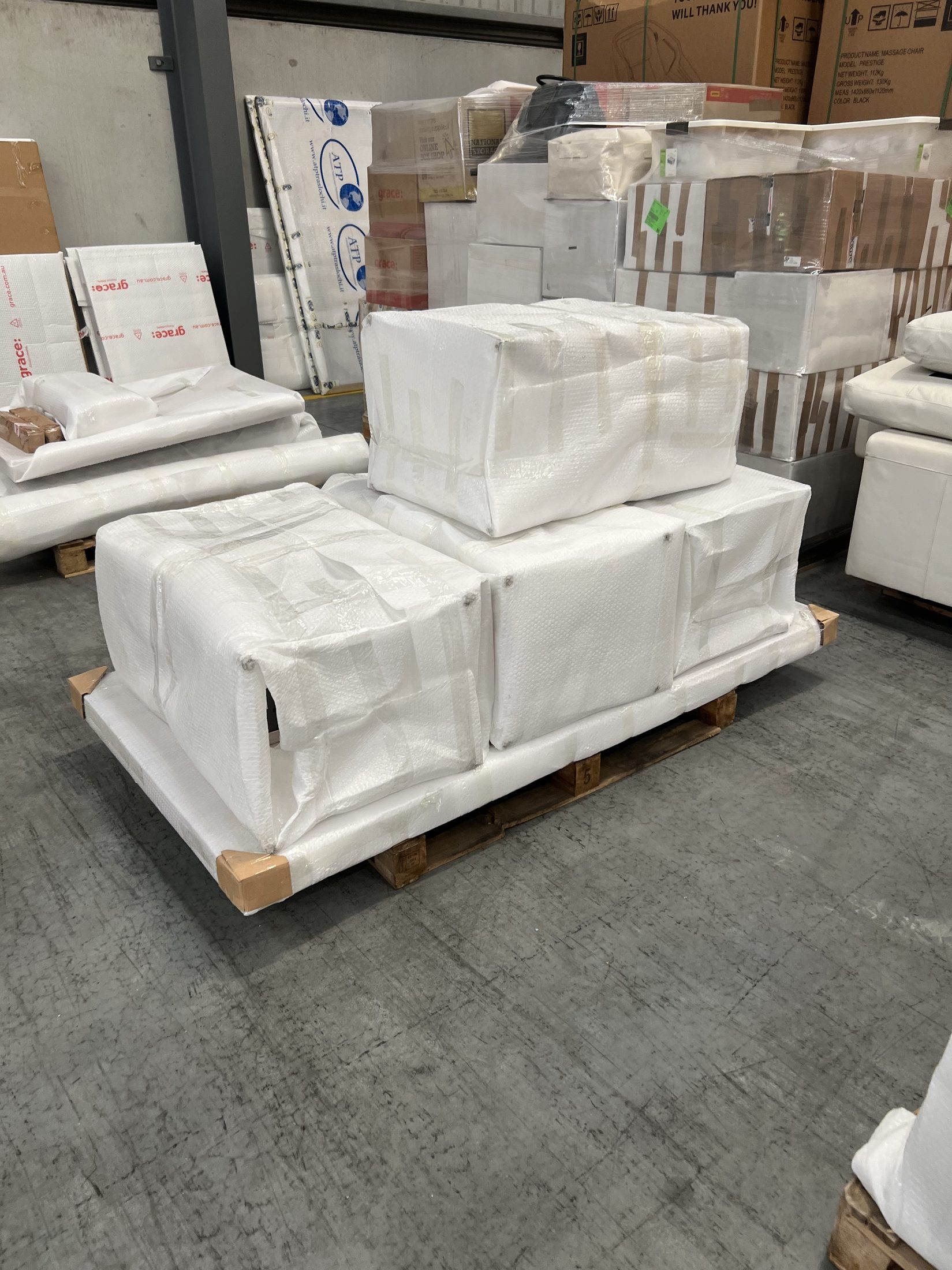 High-value furniture wrapped and stored on pallets